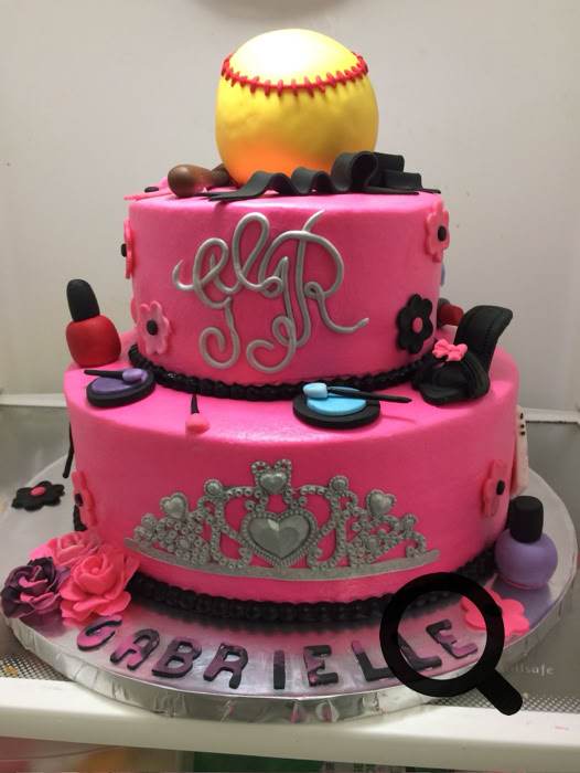 Charming dessert table setup featuring personalized cake pops and a tiered cake, perfect for celebrations.