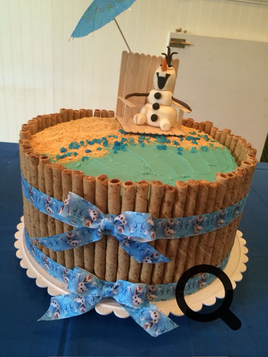 Charming dessert table setup featuring personalized cake pops and a tiered cake, perfect for celebrations.